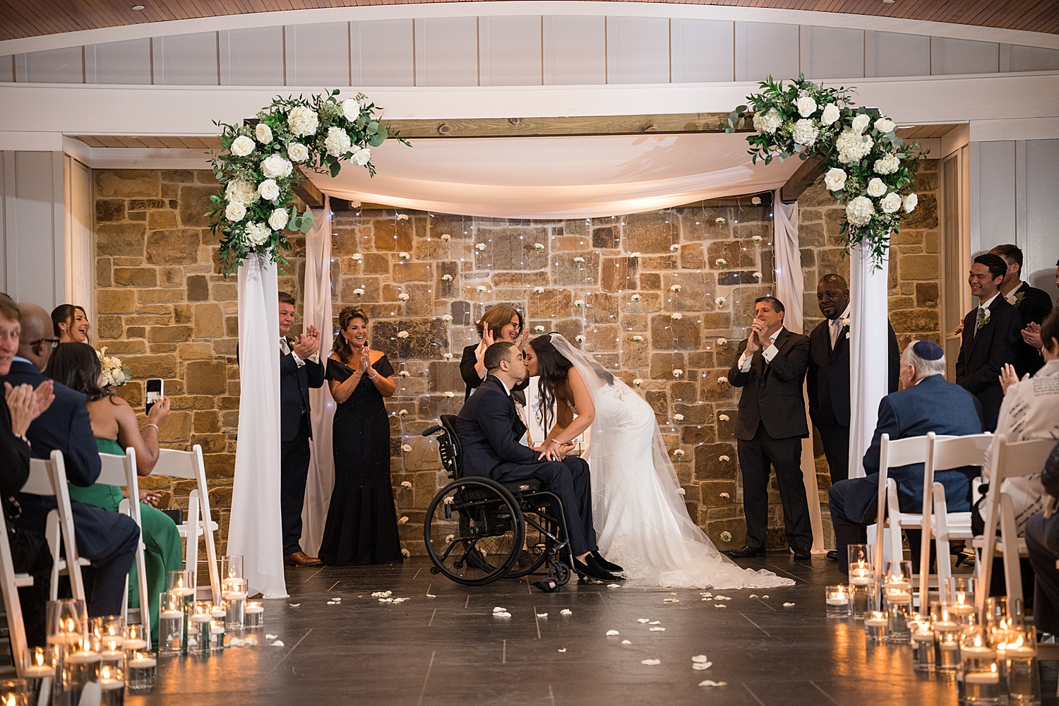 bride and groom first kiss