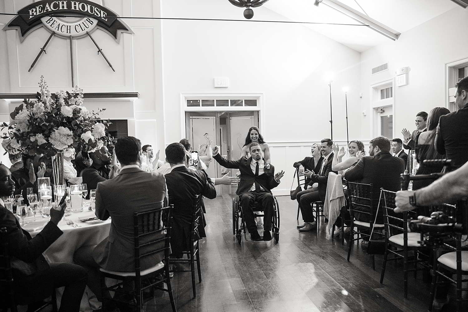 bride and groom enter reception black and white