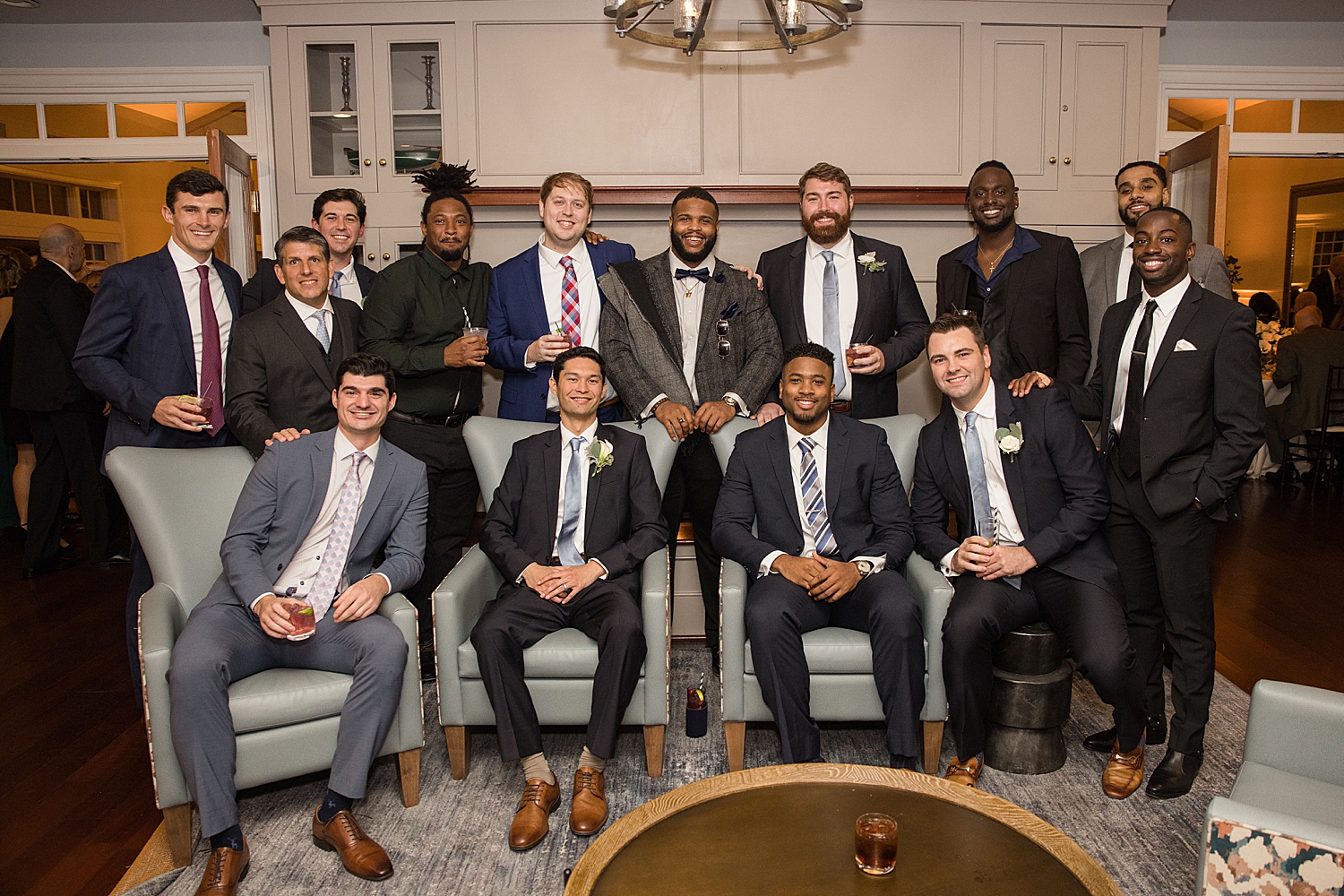 groomsmen lounge during cocktail hour