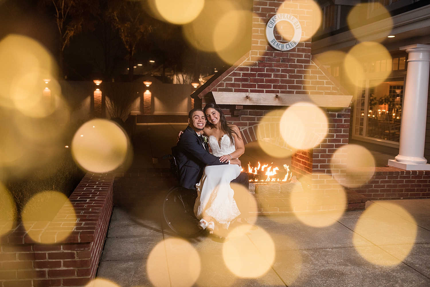 bride and groom night portrait with warm bokeh