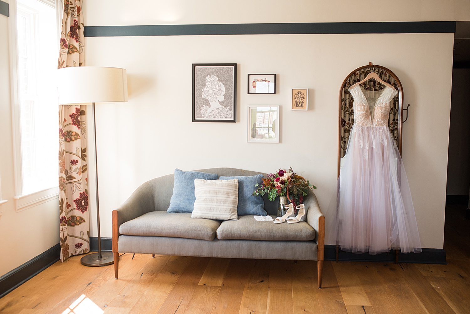 bridal gown hanging from mirror