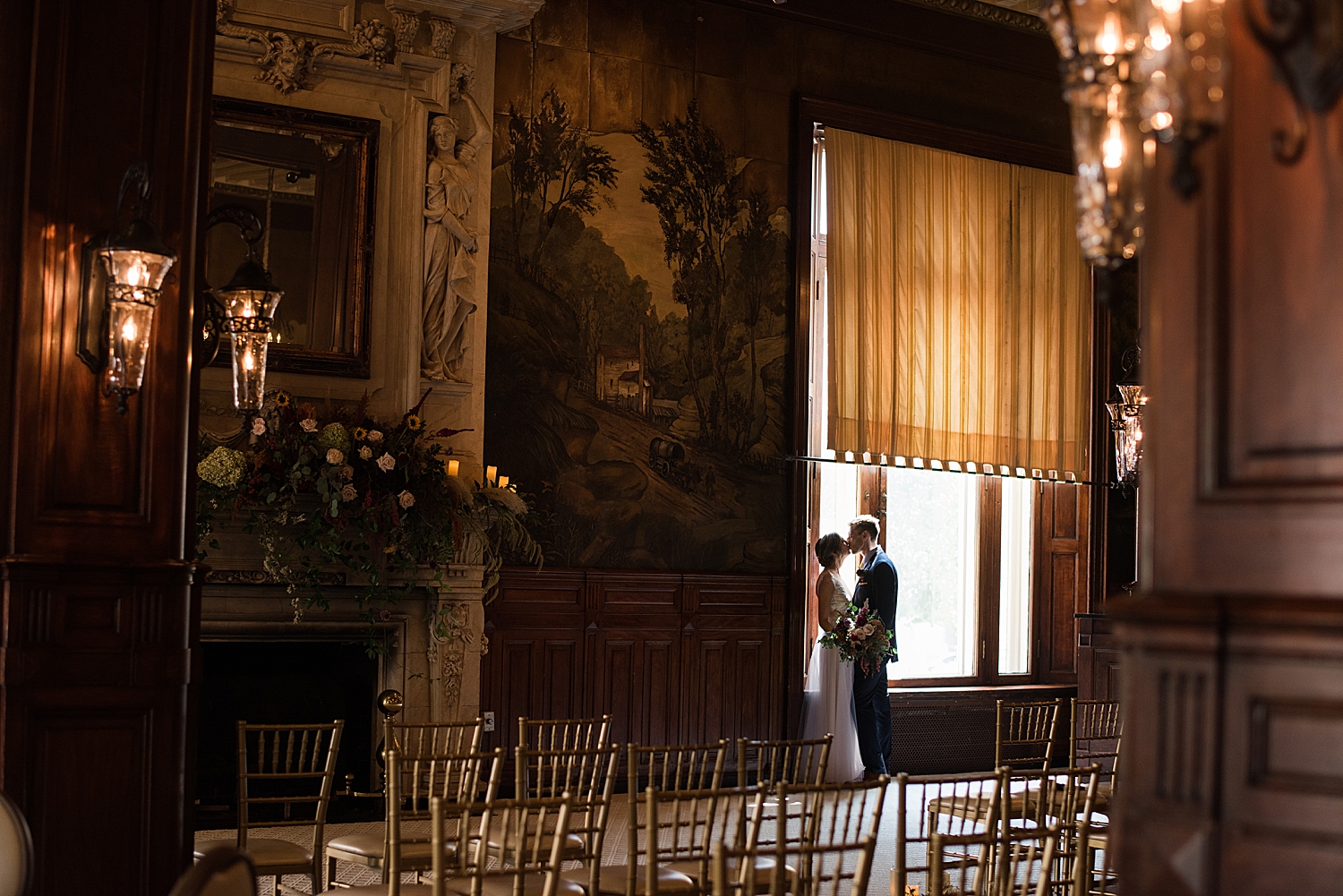 bride and groom silhouette against window in historic hotel