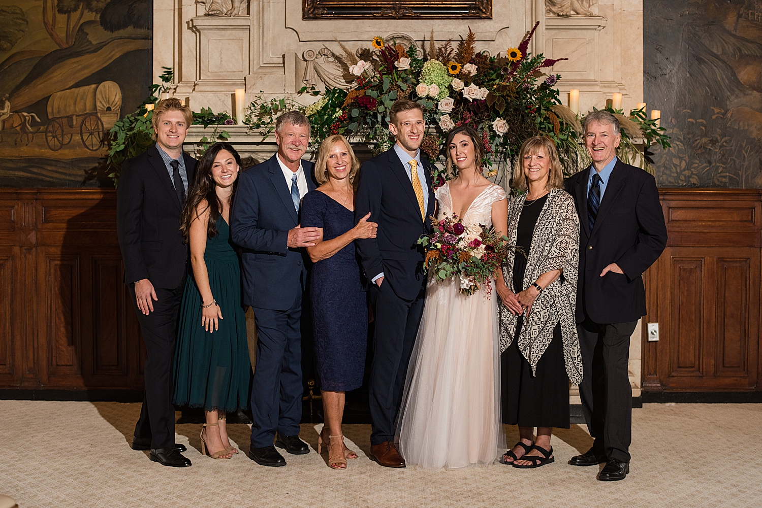 bride and groom with family