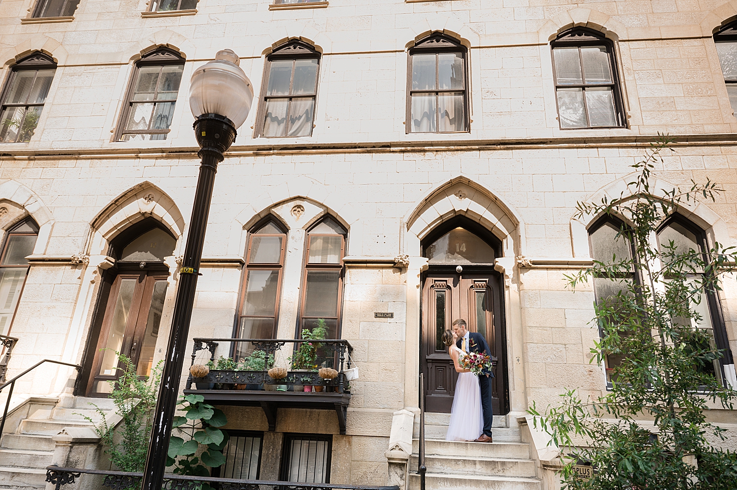 bride and groom kiss outside in baltimore