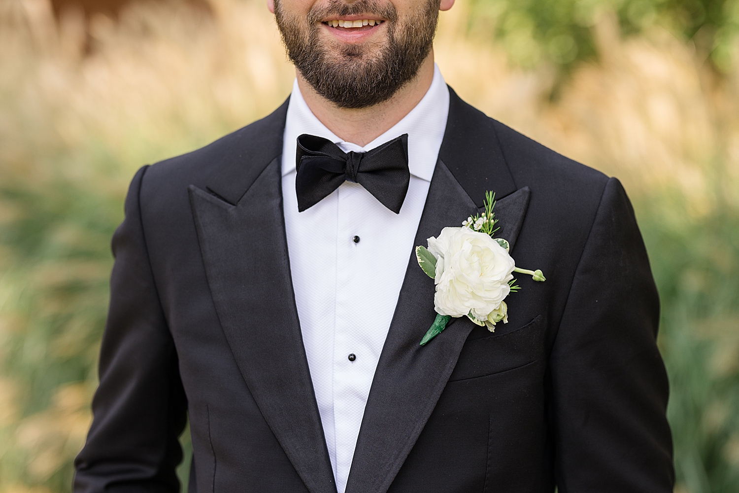 groom detail bow tie tuxedo boutonniere