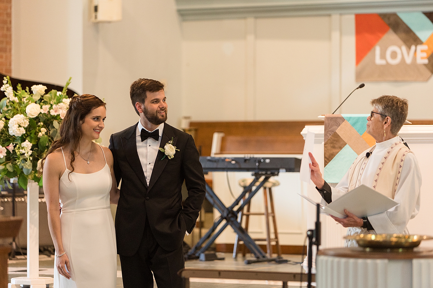 bride and groom listen during ceremony