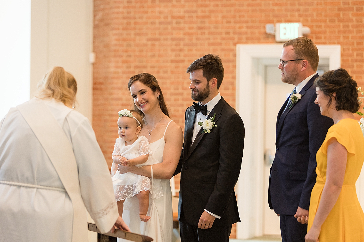 bride and groom wedding ceremony church baby