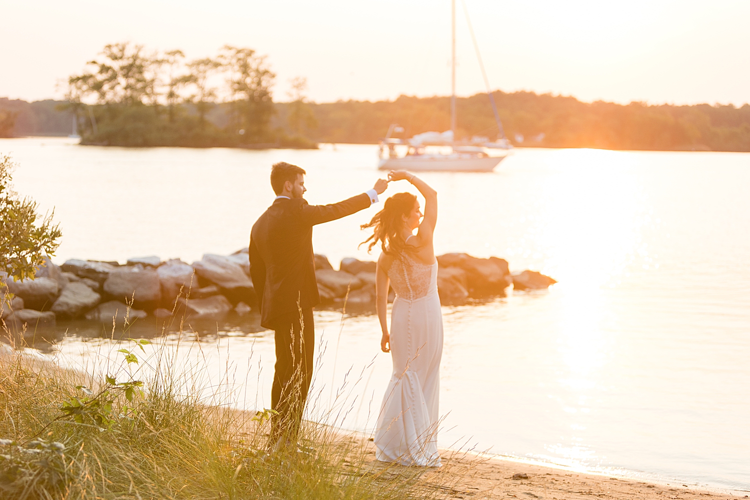 bride and groom on beach at sunset spin