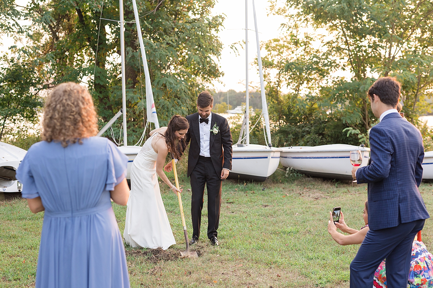 bride and groom dig up whiskey