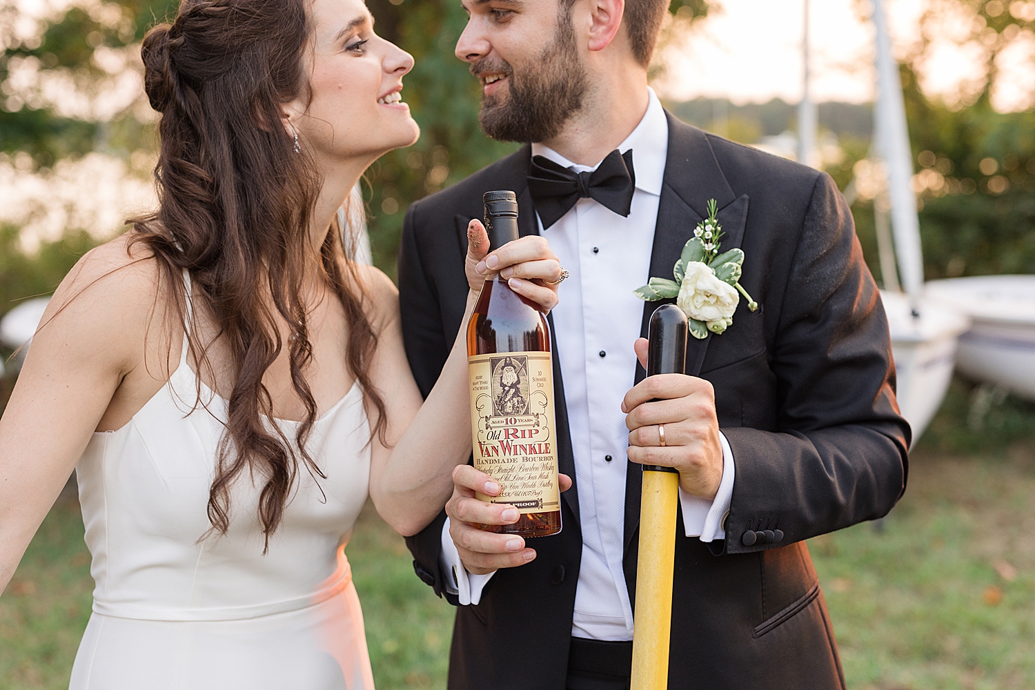 bride and groom dig up whiskey