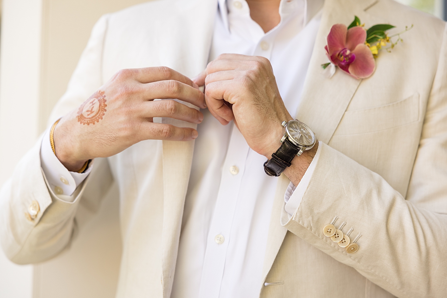 groom details henna light suit watch boutonniere