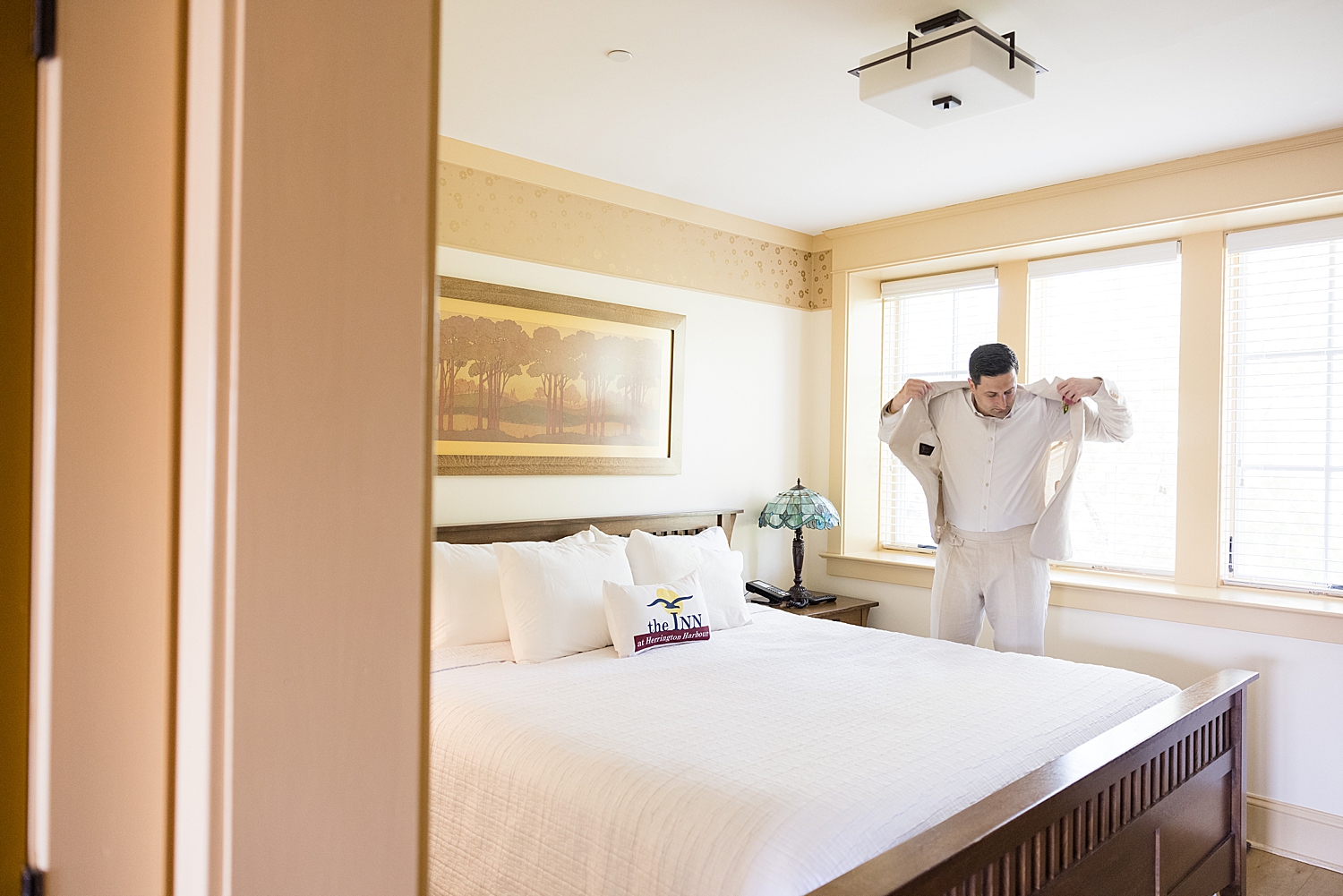 groom getting into suit