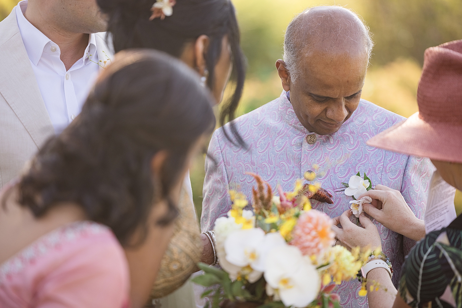 candid wedding guests with florals