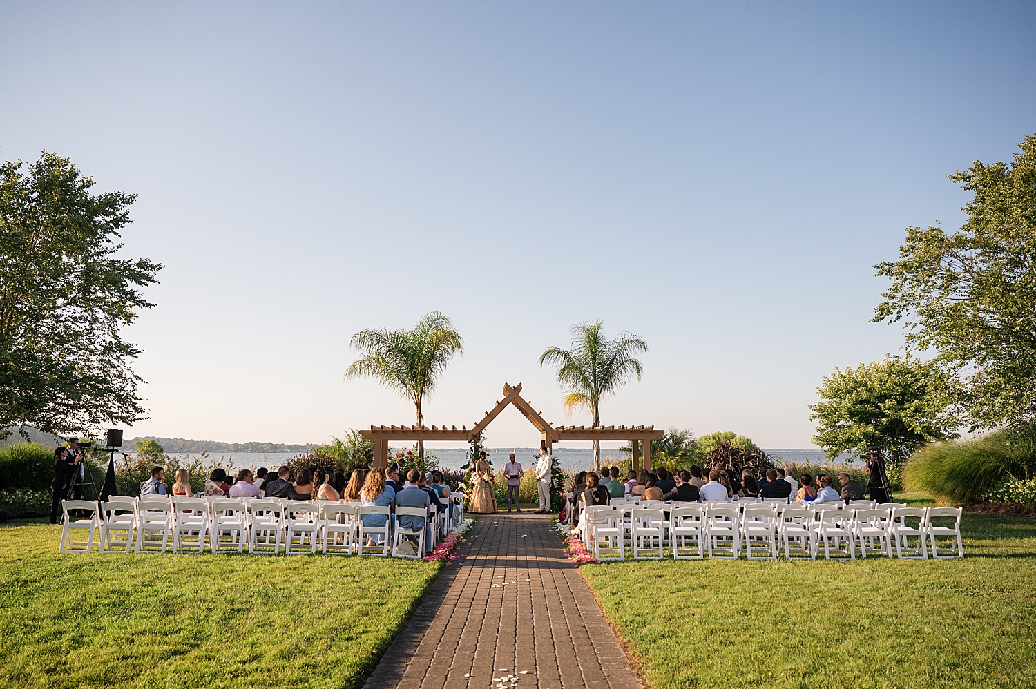 wide shot herrington on the bay wedding ceremony polynesian lawn