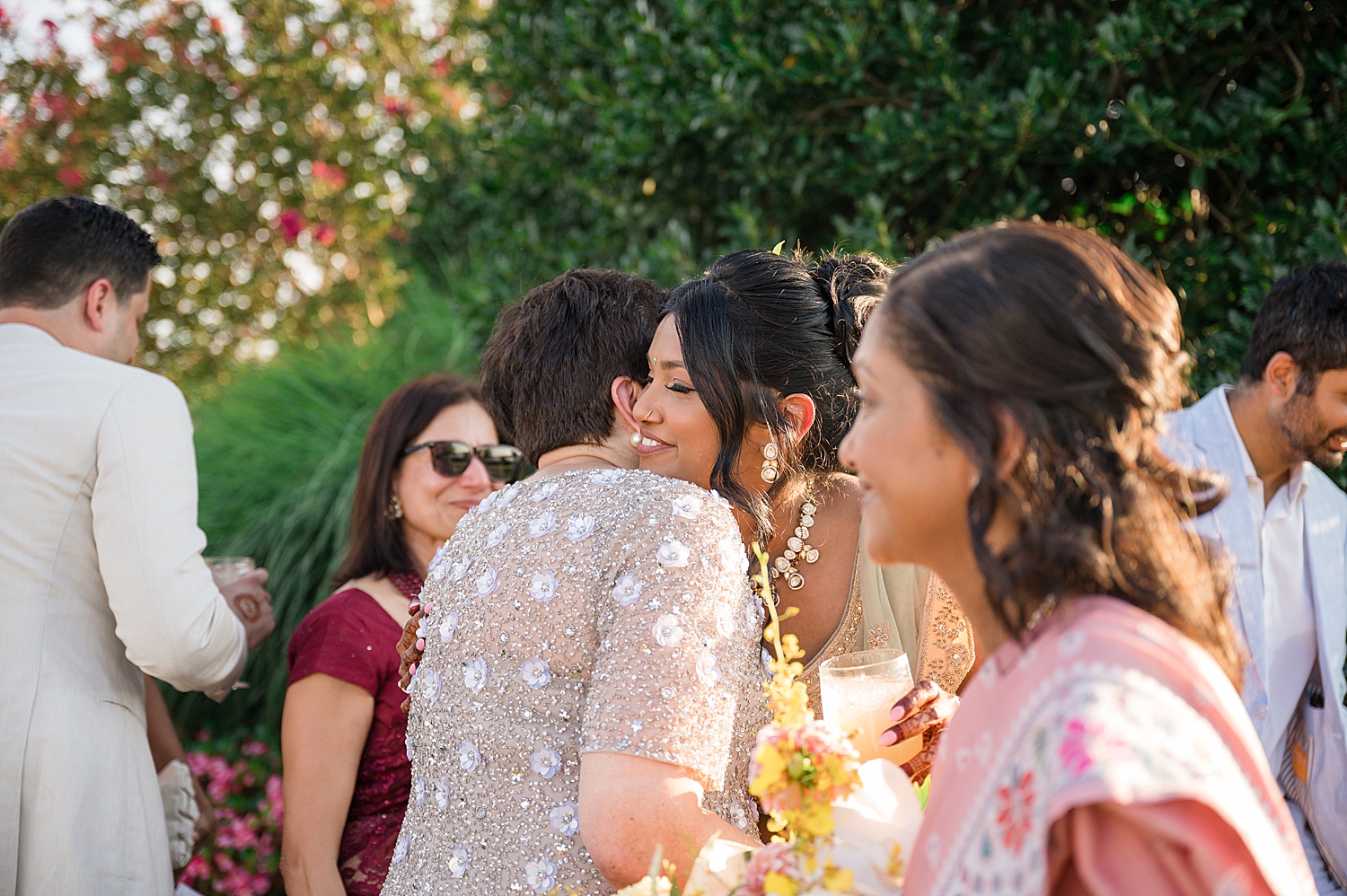 bride embraces guests after wedding