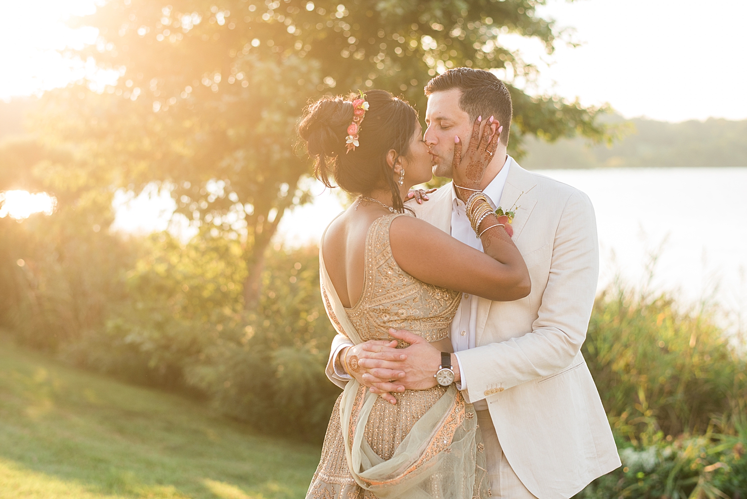 bride and groom sunset kiss