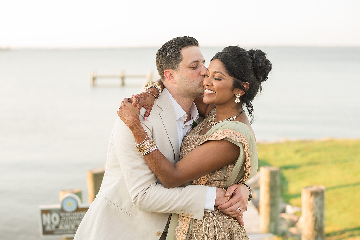 groom kisses bride's cheek