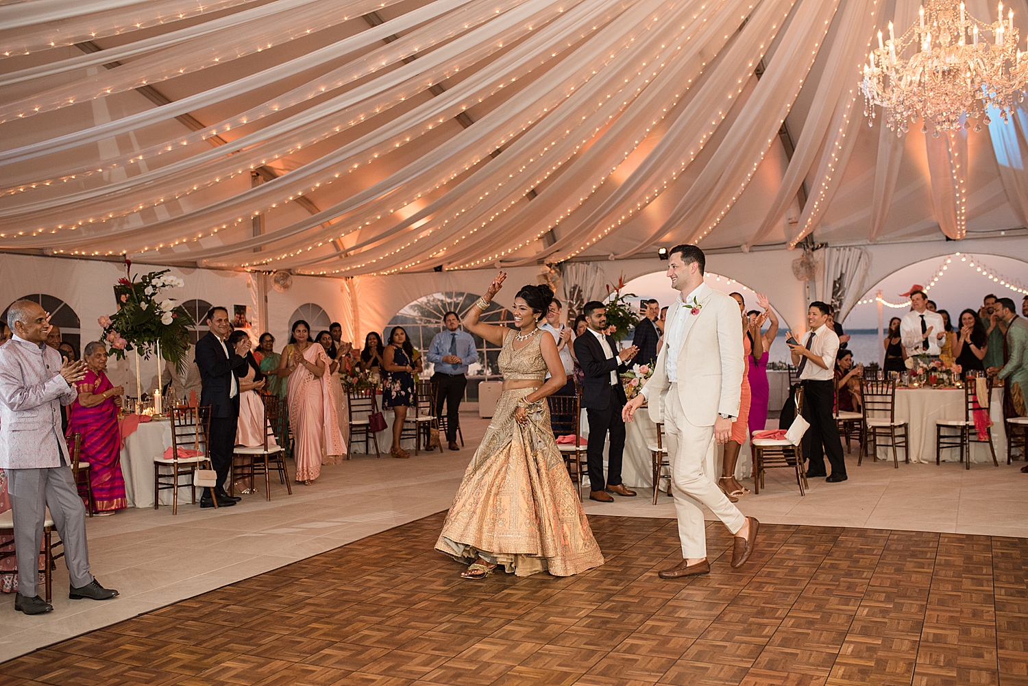 bride and groom enter reception dance floor