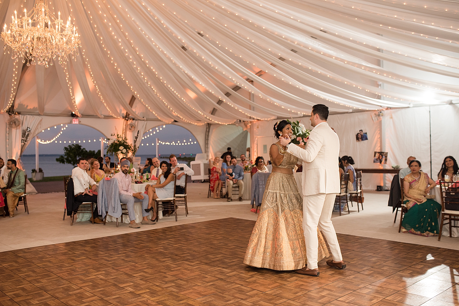 bride and groom first dance tent