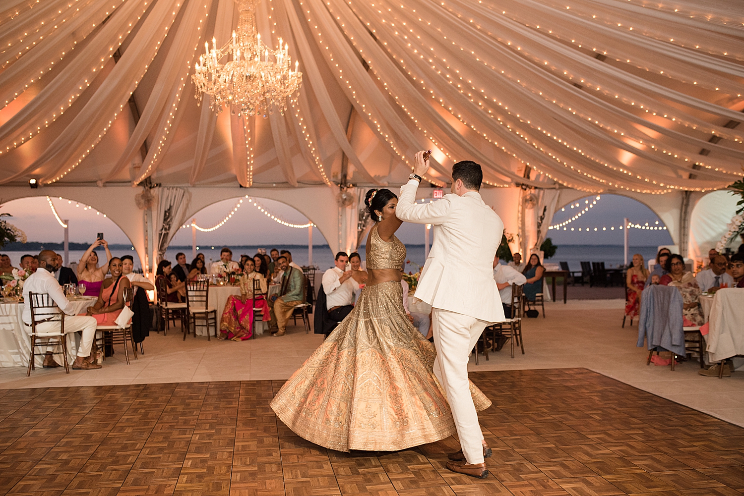 bride and groom first dance tent