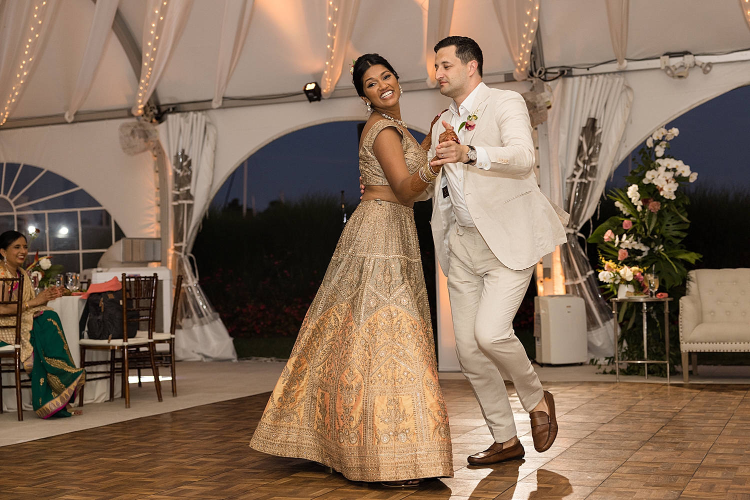 bride and groom first dance tent