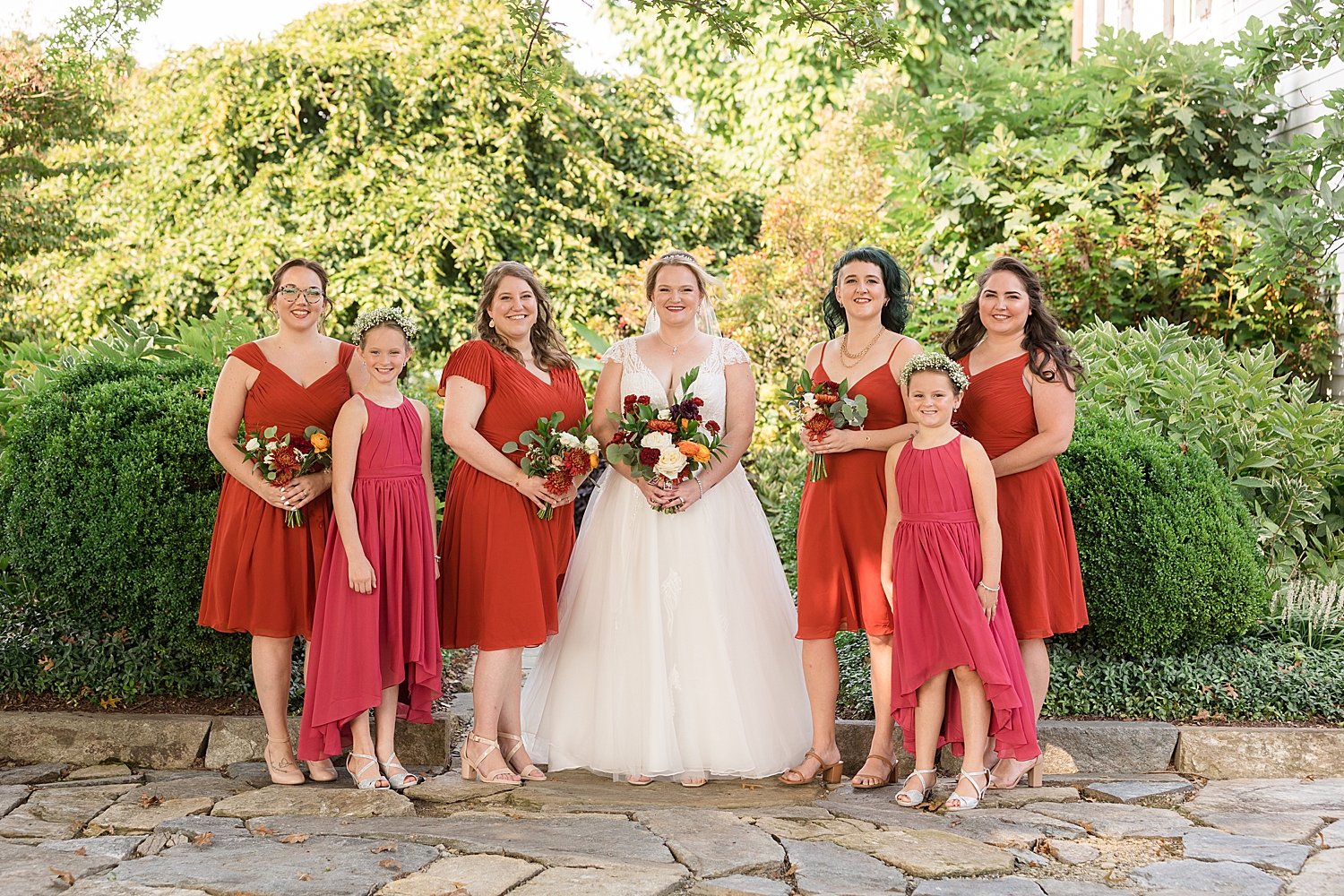 bride with bridesmaids and flower girls