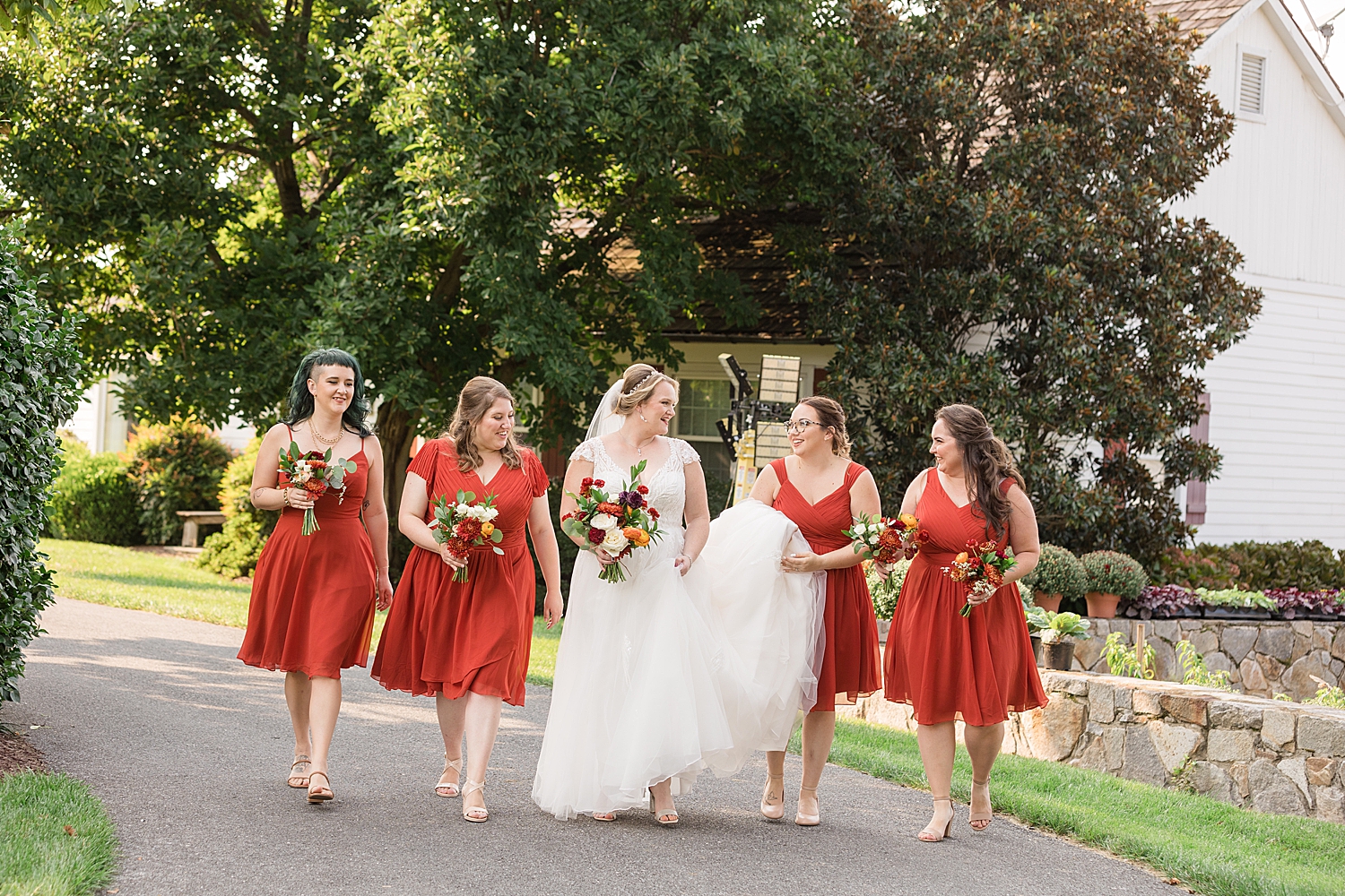 bride and bridesmaids in orange walking