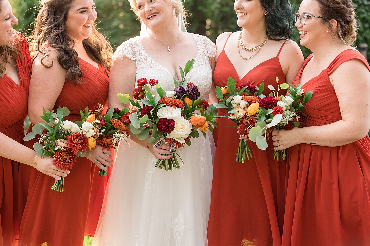 bride and bridesmaids in orange florals