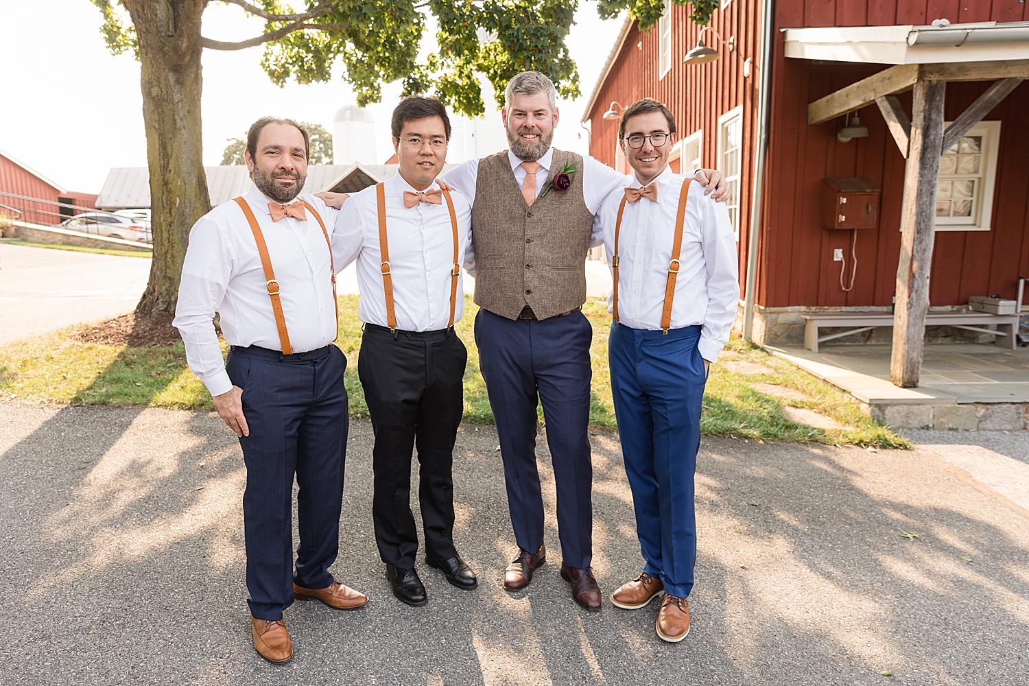 groom and groomsmen in suspenders