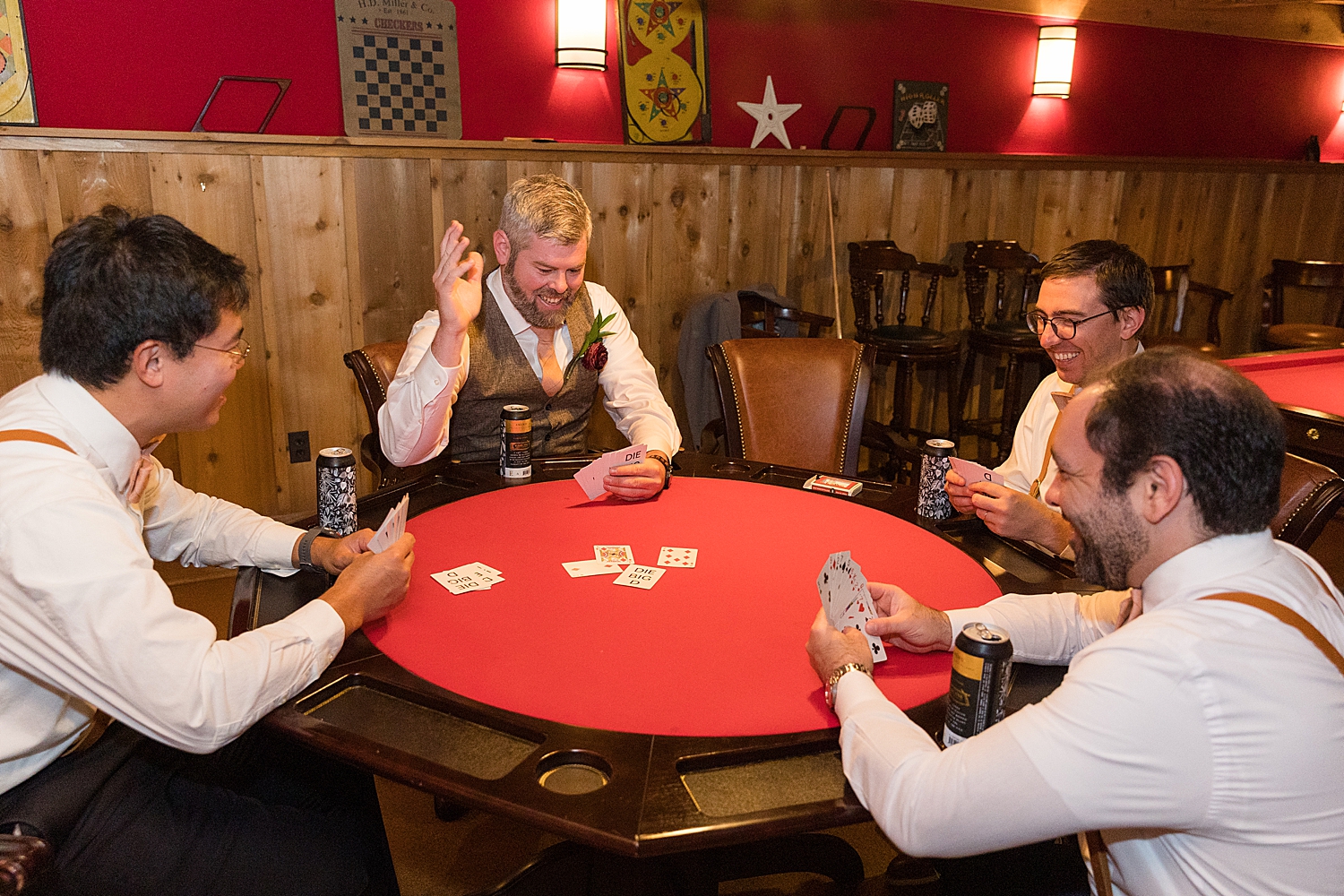 groom and groomsmen playing cards