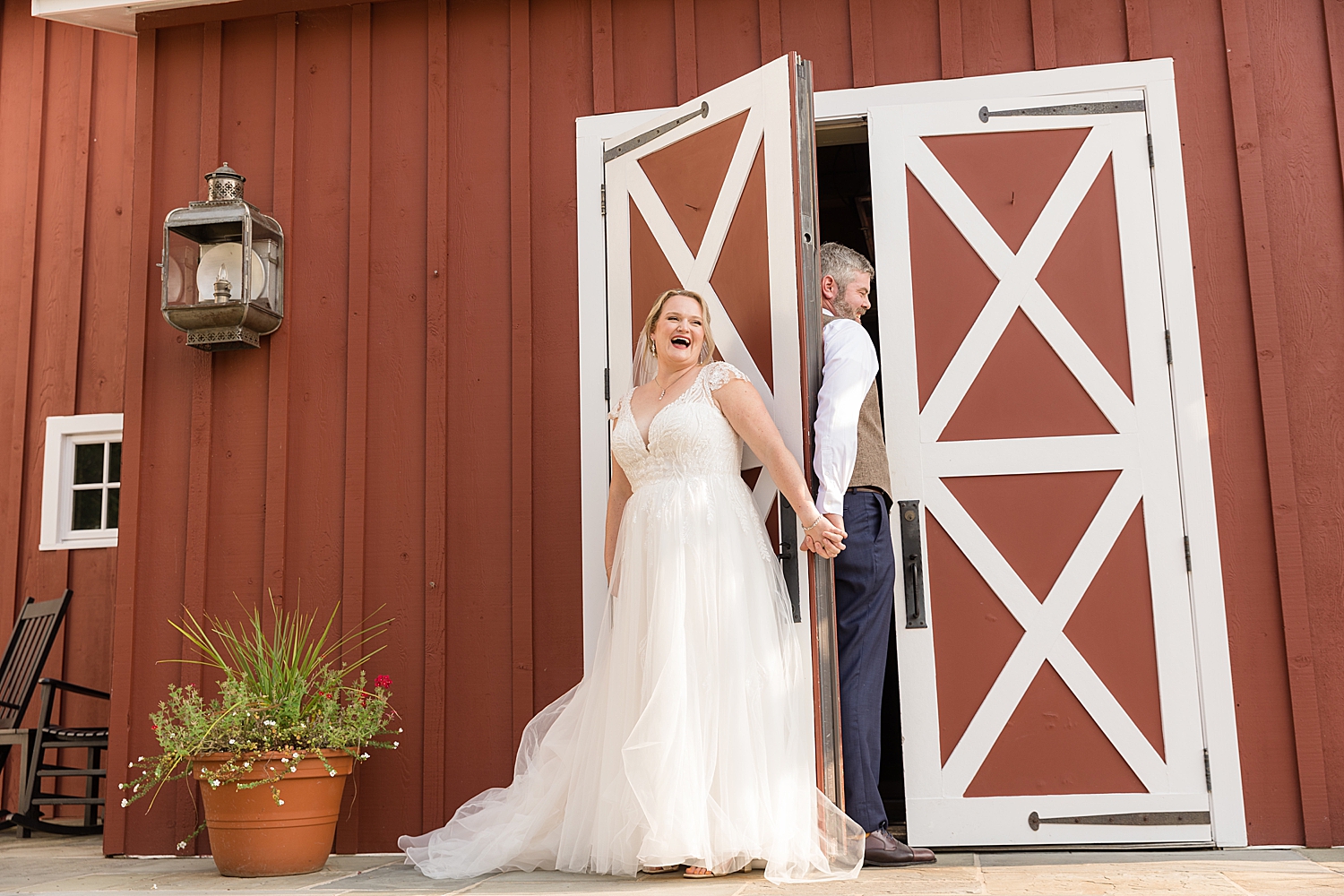 bride and groom first touch barn