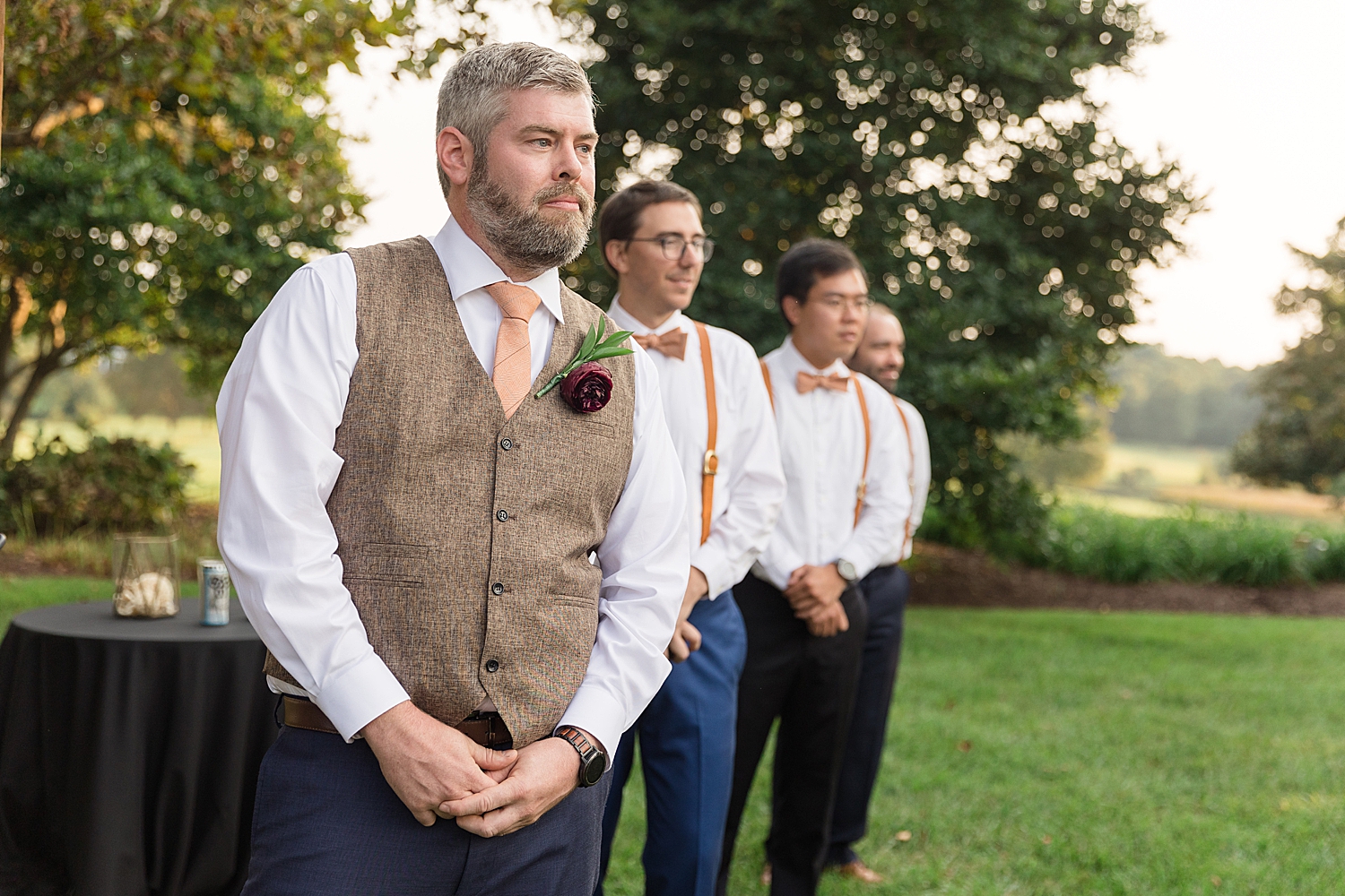 groom waiting for bride at end of aisle