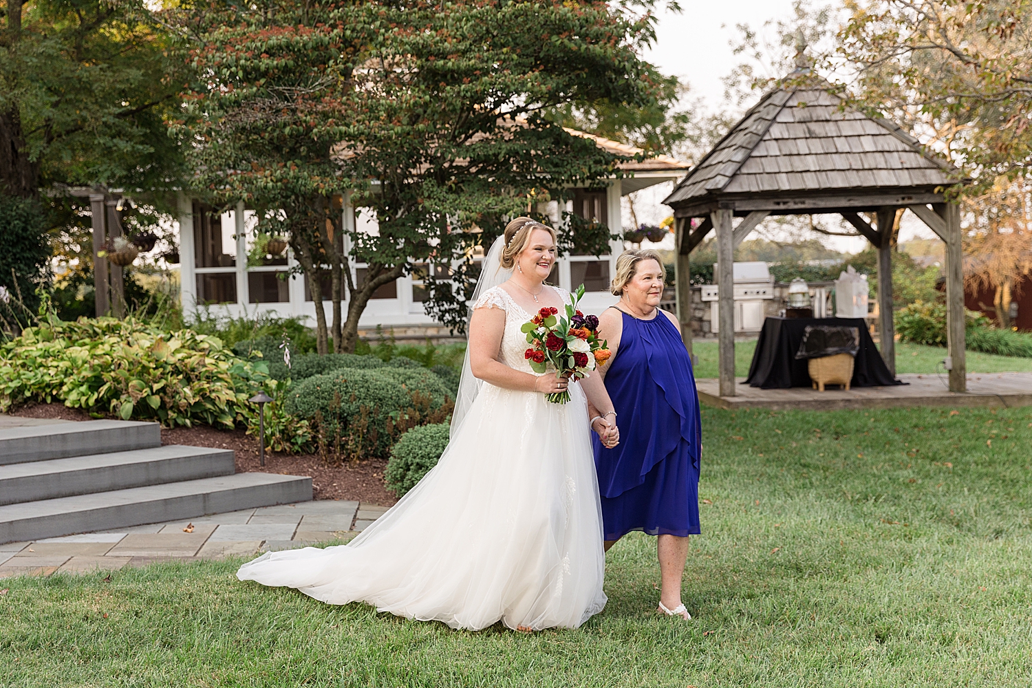 bride entering ceremony with mom