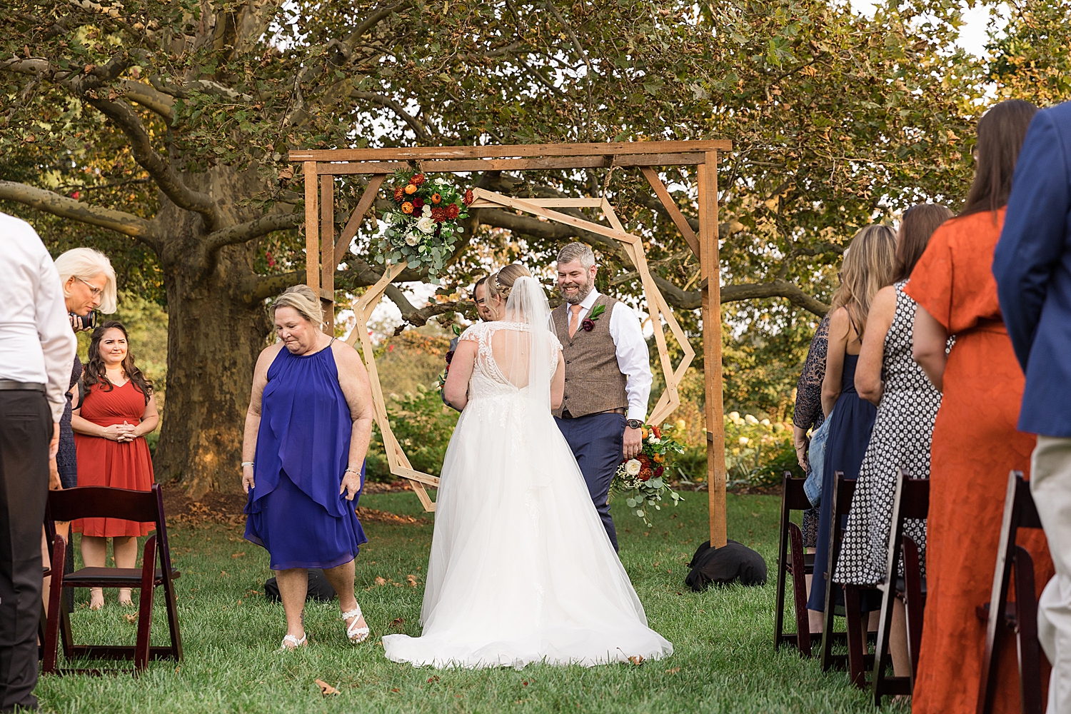 mom giving bride away to groom