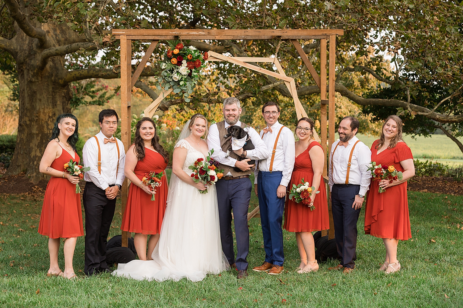 full wedding party smiling