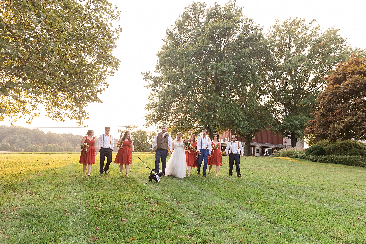 full wedding party walking field