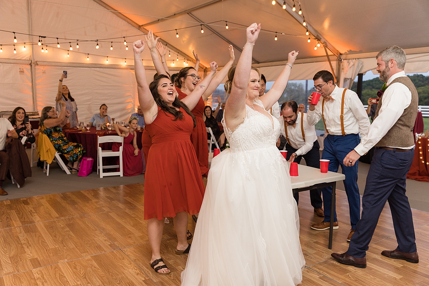 bride and bridesmaids cheering