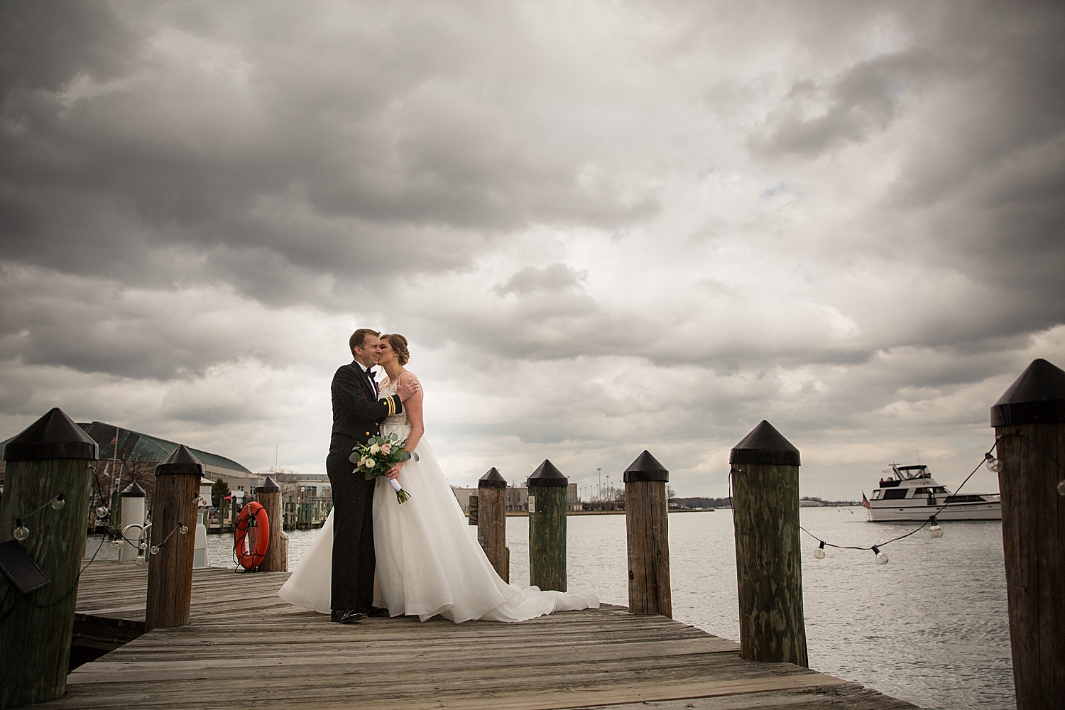 bride and groom on annapolis dock