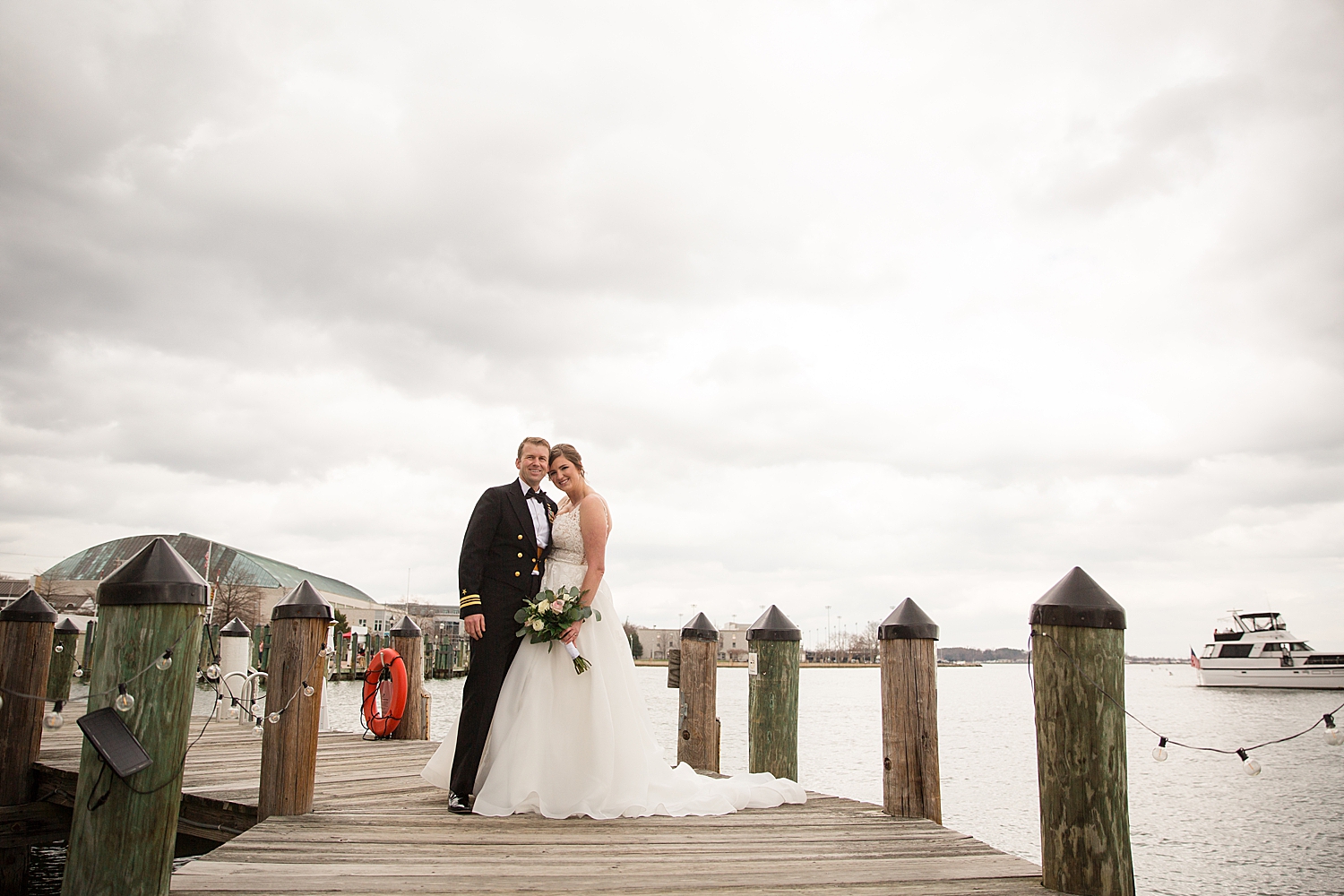 bride and groom portrait on annapolis dock