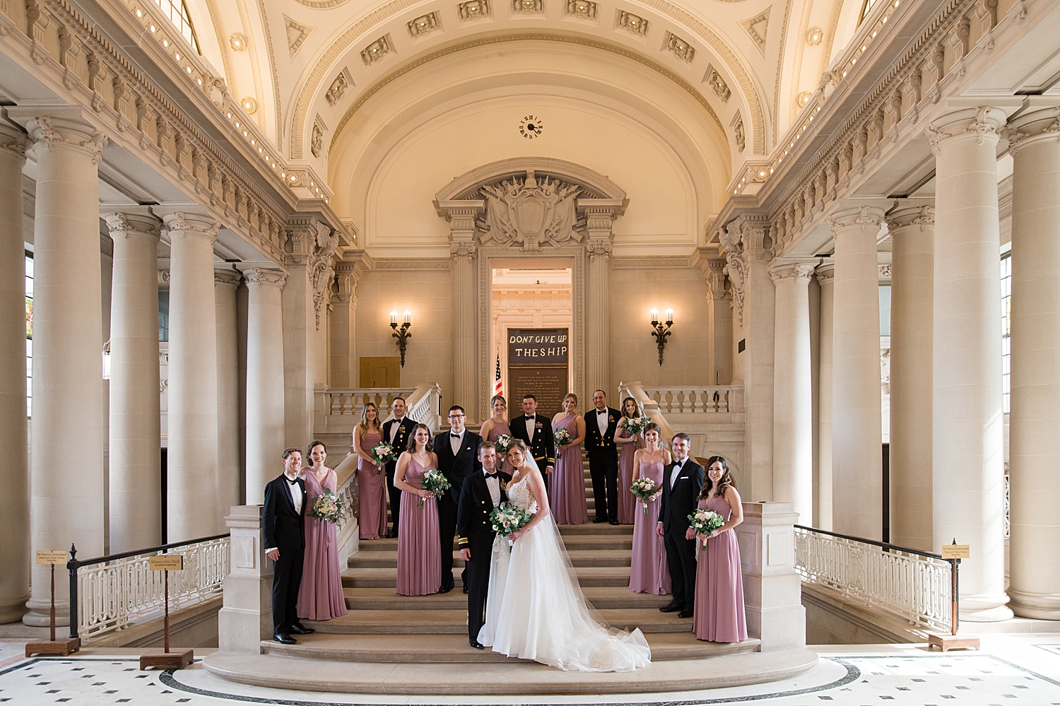 full wedding party on bancroft hall stairs indoor