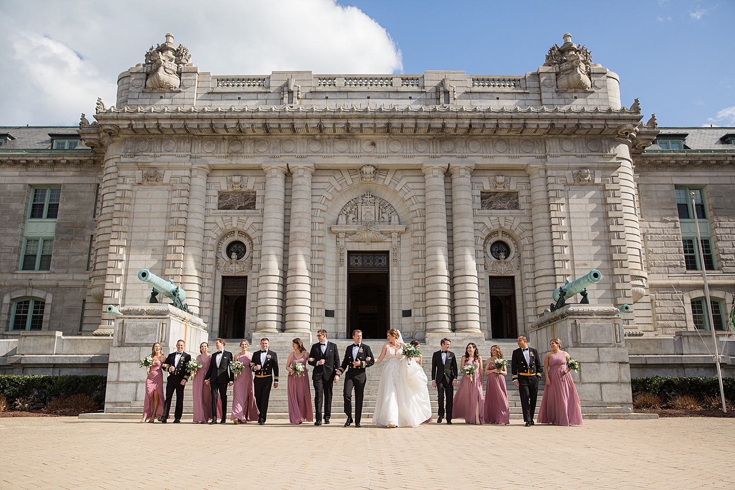 full wedding party in front of bancroft hall