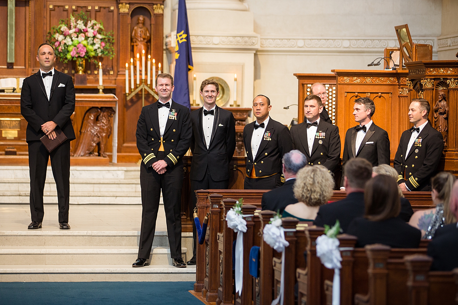 groom waiting for bride inside usna chapel