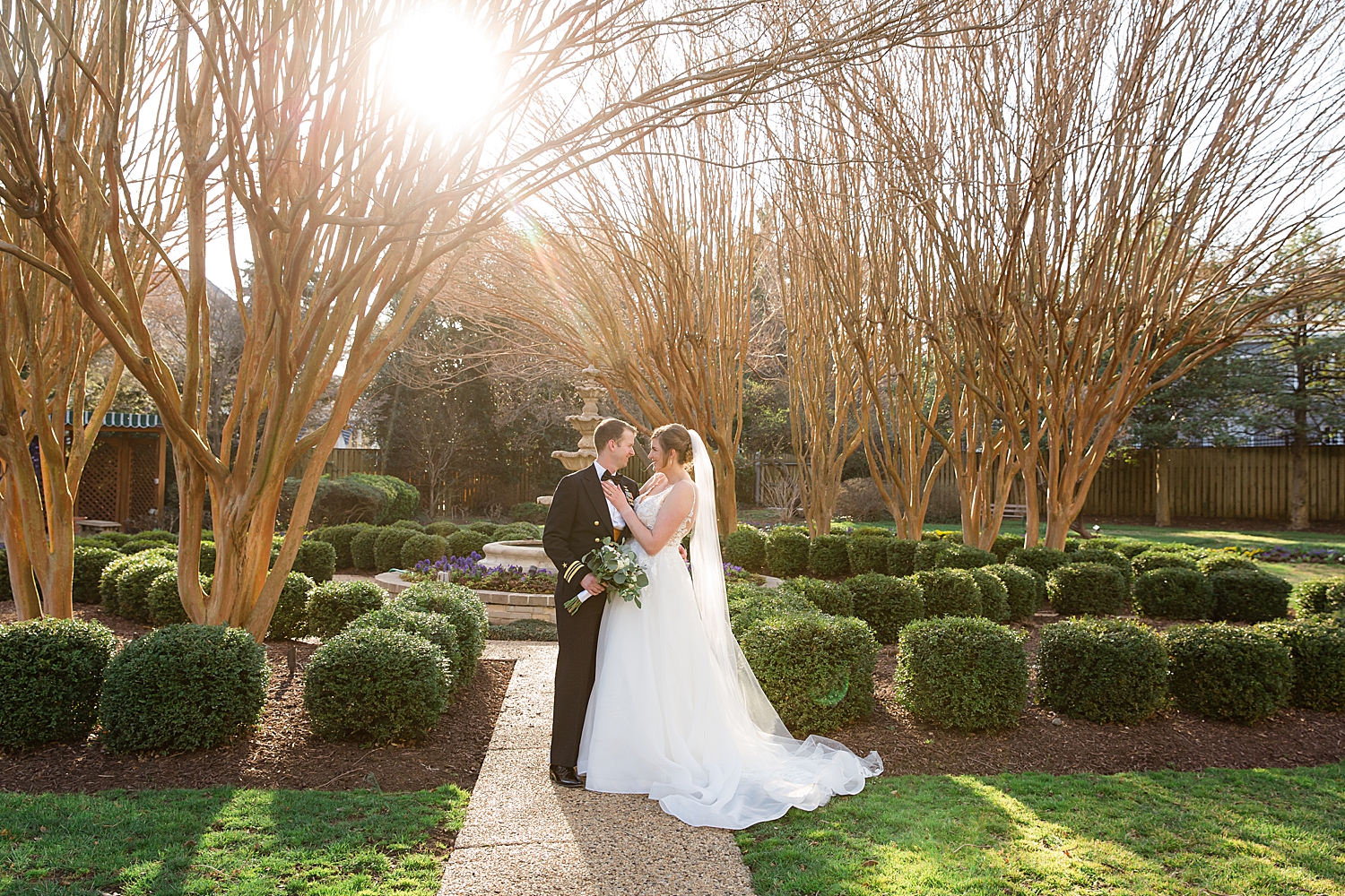 couple portrait in usna garden sun peeking through