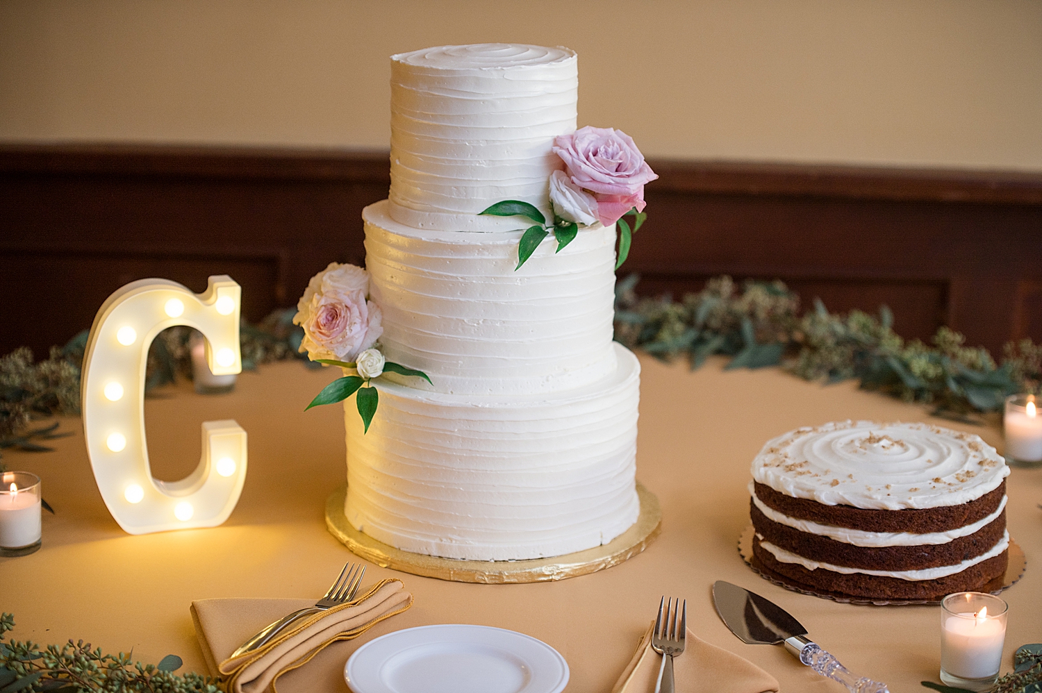 white wedding cake with pink flowers