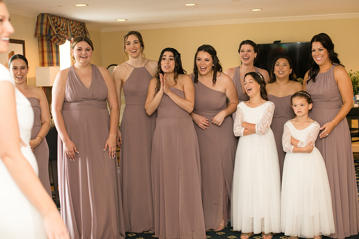 bride reveals dress to bridesmaids