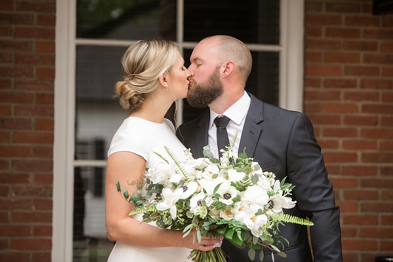 bride and groom kiss