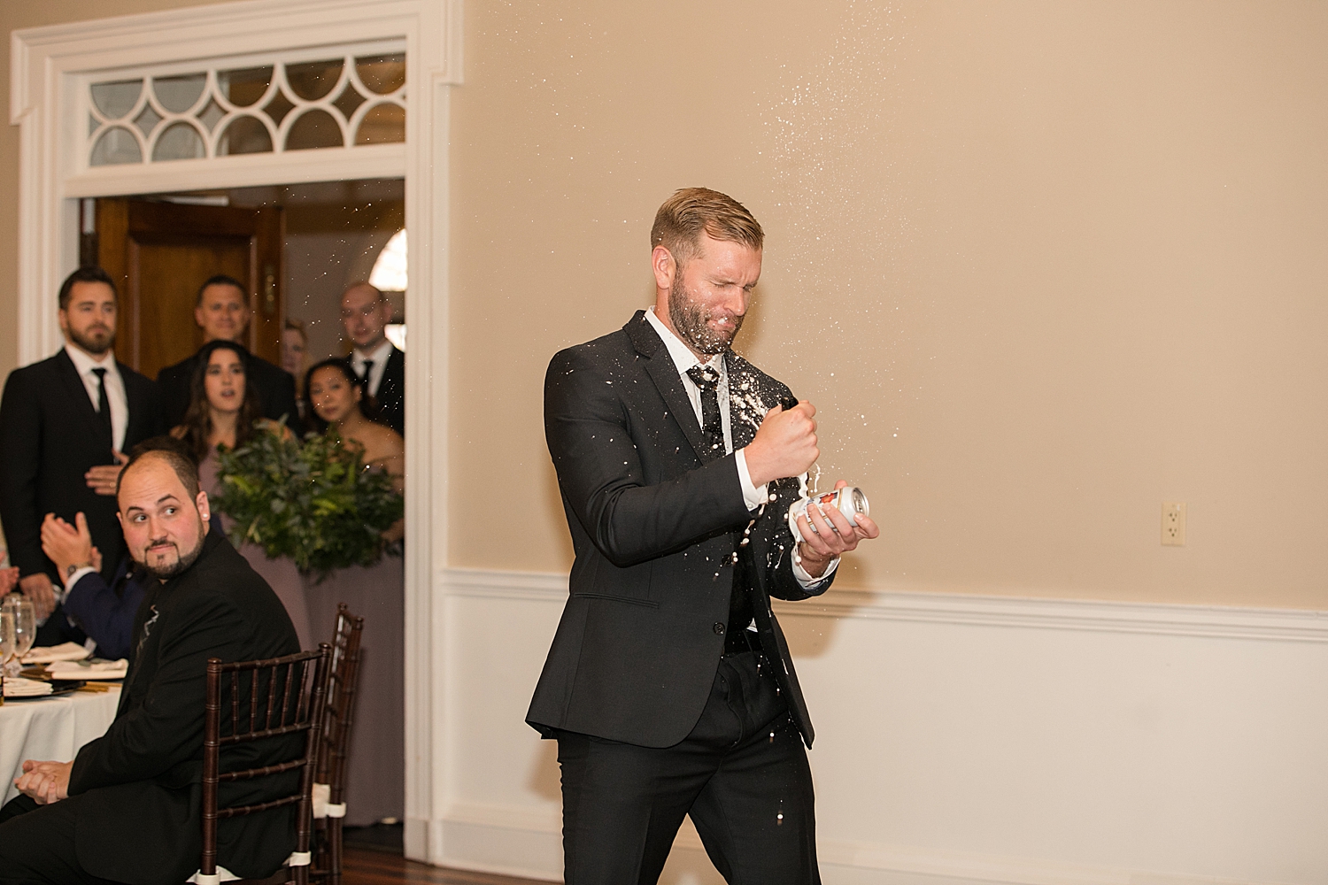 beer explodes on groomsmen as he enters reception