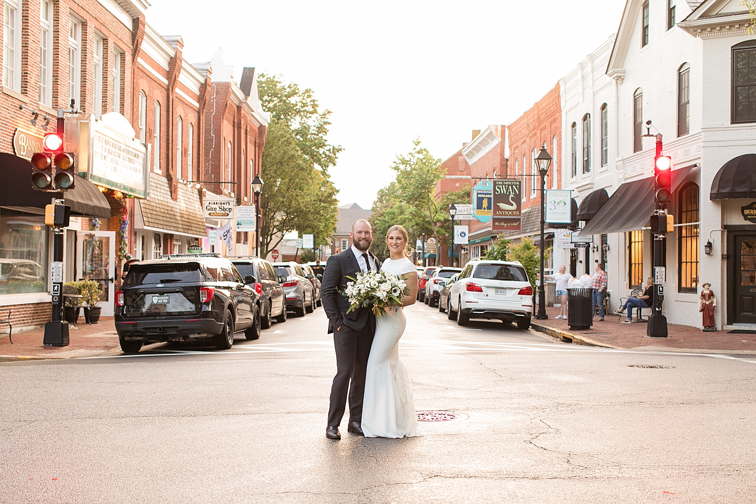 bride and groom pose in street in easton md