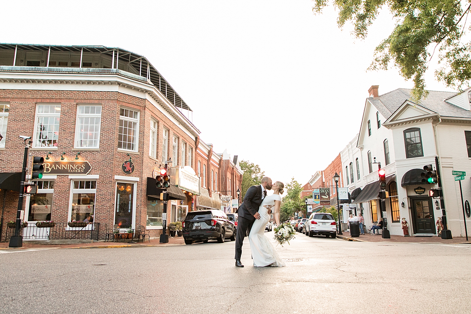 bride and groom pose in street in easton md