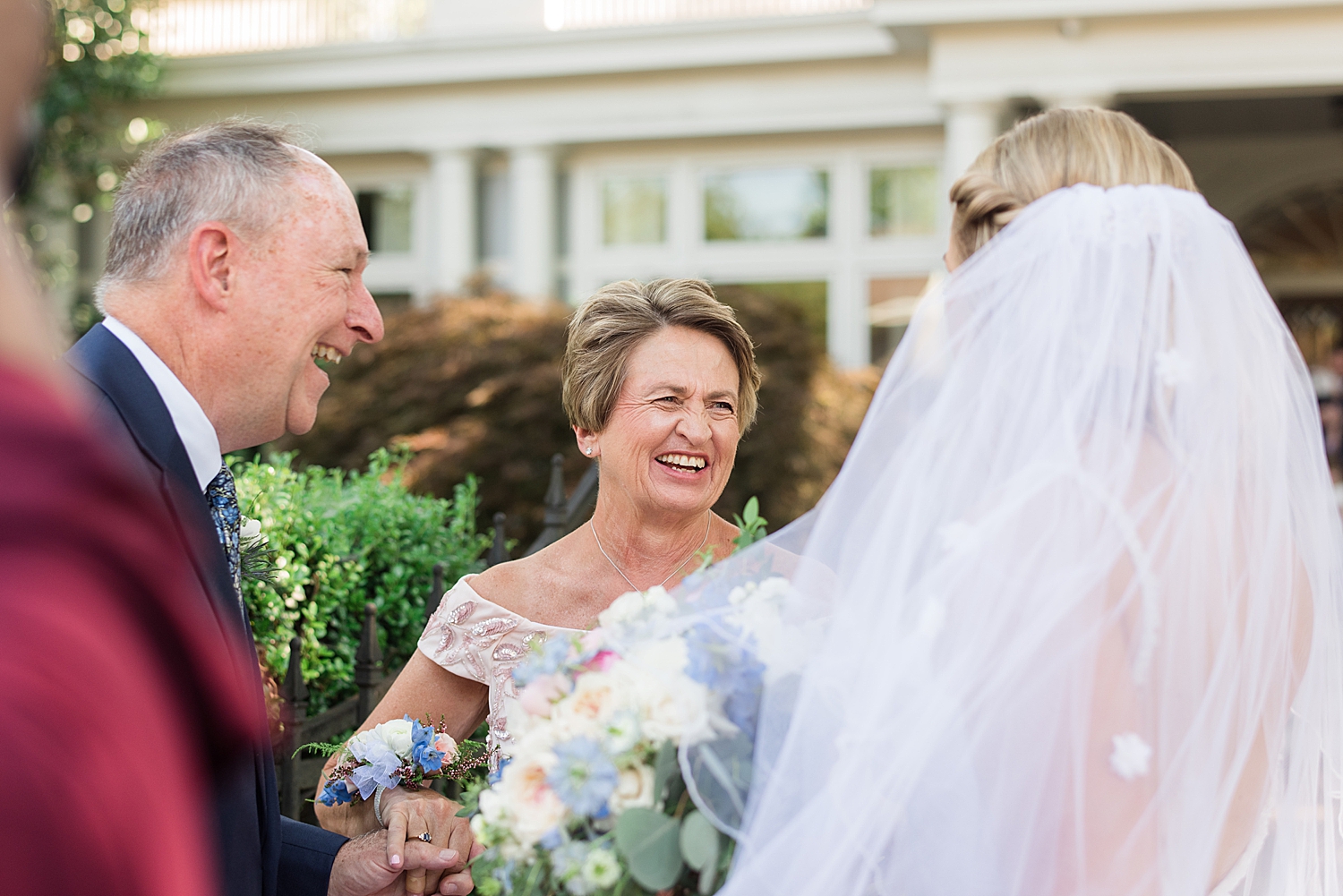 bride laughing with family